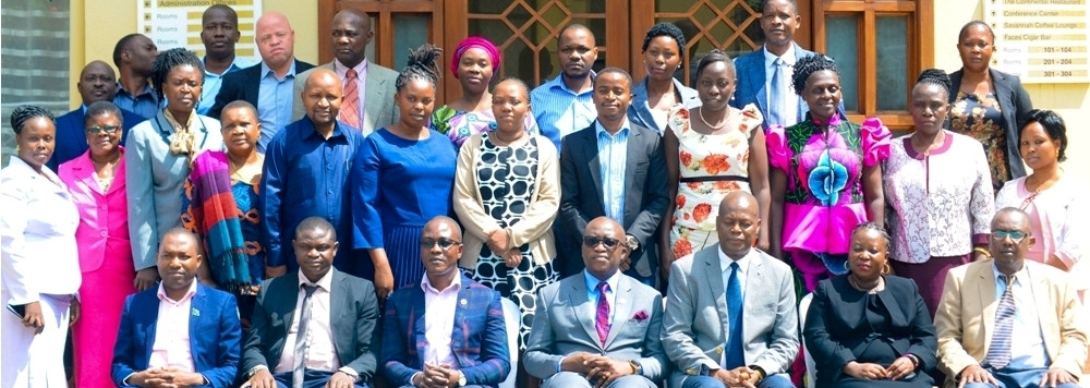 Naibu Waziri, Ofisi ya Waziri Mkuu anayeshughulikia Kazi, Vijana na Ajira Mhe. Anthony Mavunde (katikati waliokaa) akiwa kwenye picha ya pamoja na wajumbe wa Baraza la Wafanayakazi wa Ofisi hiyo uliofanyika Jijini Arusha.